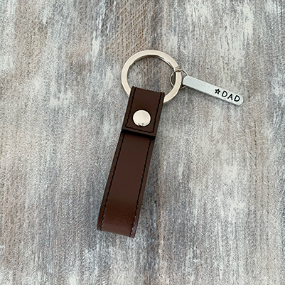 Brown leather keychain with metal bar