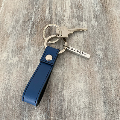 Royal blue leather keychain with metal bar